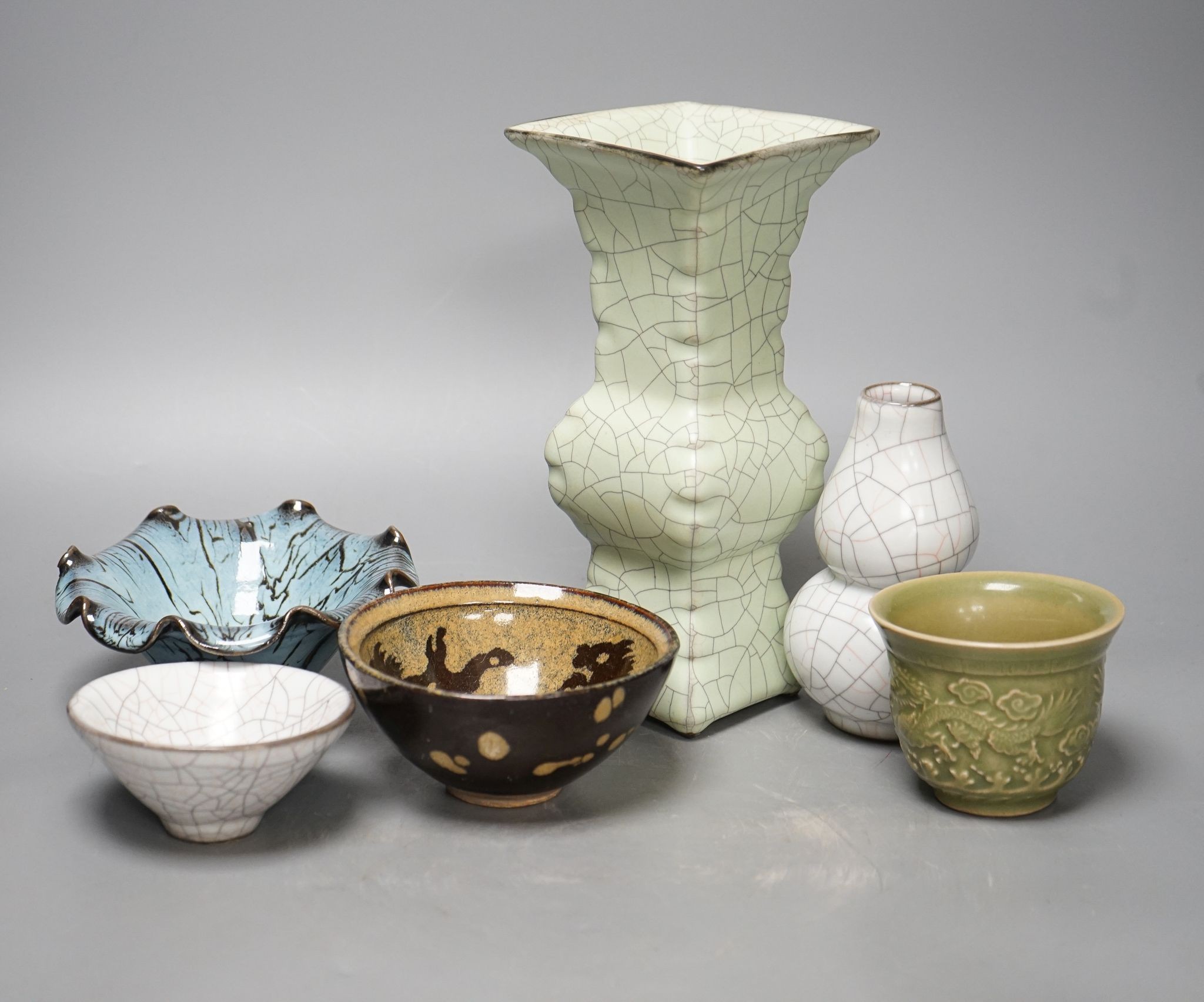 Chinese ceramics: three bowls, a cup and two vases, tallest vase 23cm
